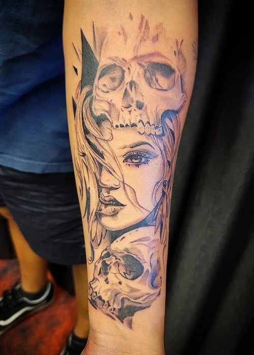 Image of Skull around woman face Tattoo