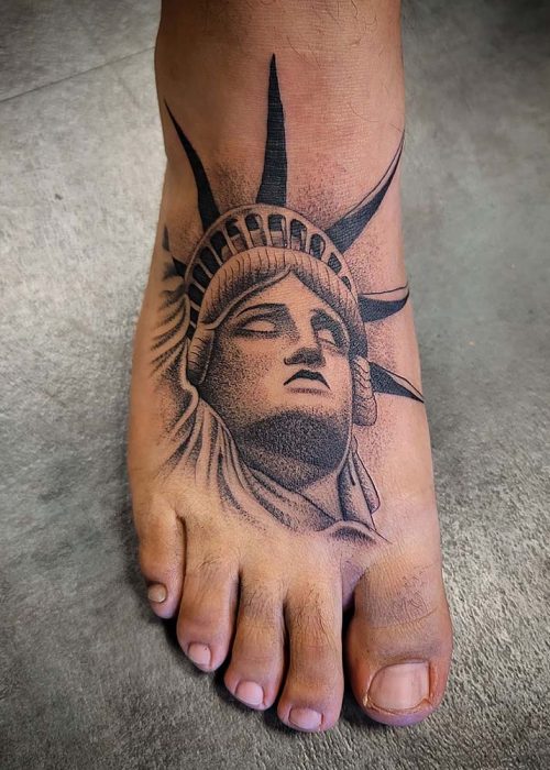 Statue Of Liberty Foot Tattoo - Heatstroke Tattoo